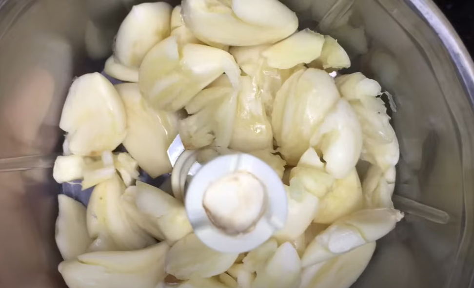 Blend garlic coarsely